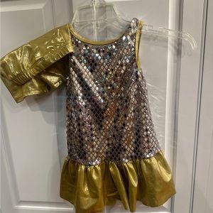 Girl’s sparkly gold and mirror dress and shorts.